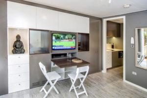 Inspiration for a small contemporary open plan dining in Sydney with grey walls, light hardwood floors and no fireplace.