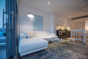 Photo of a mid-sized contemporary open concept living room in Sydney with white walls, light hardwood floors and no fireplace.