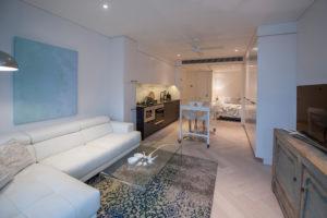 Design ideas for a mid-sized contemporary open concept living room in Sydney with white walls, light hardwood floors and no fireplace.